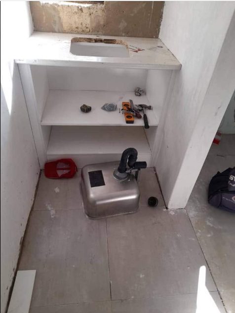 Kitchen sink installation in progress
